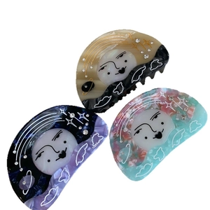 Three-piece sun goddess acetate shark hair clips with celestial patterns and rhinestones