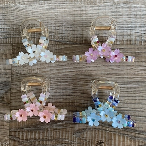Floral hair claw set in white, purple, pink, and blue with cherry blossom and crystal beads