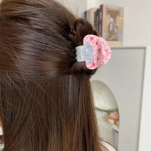Floral pattern acetate mushroom hair claw clip shown in a stylish half-up hairstyle