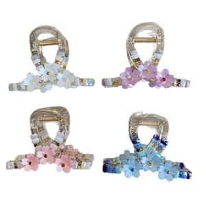 Set of four floral cherry blossom hair claws in white pink purple and blue resins