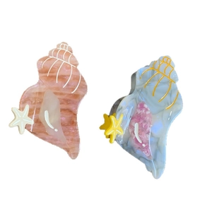 Conch shell acetate hair claw clips with marble texture and starfish accents