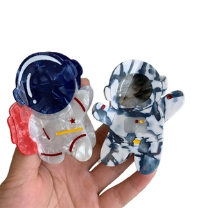 Pinces à cheveux astronaute en acétate avec texture marbrée en rouge et bleu