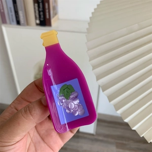 Detailed view of a unique purple grape juice bottle acetate hair claw clip for women