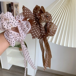 Polka dot bow hair claw clip with long tassels for women in pink and brown colors