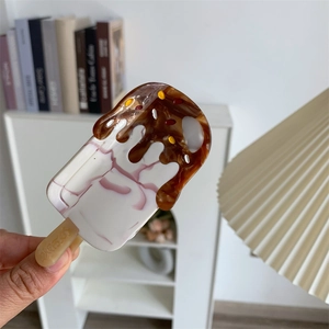Detailed close-up of ice cream shaped acetate hair claw with Good Luck engraving