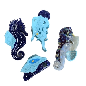 Ensemble de pinces à cheveux créatures marines bleues en forme d'hippocampe et coquillage