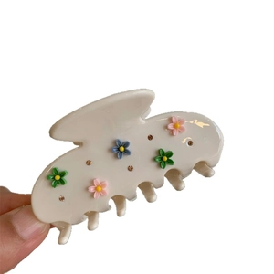 Pince à cheveux en résine crème avec motifs floraux colorés et strass étincelants