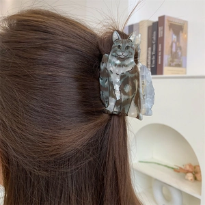Creative acetate hair claw clip with cat design in marbled grey worn on hair