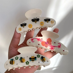 Mollelette per capelli con motivi floreali, api e farfalle e dettagli in strass