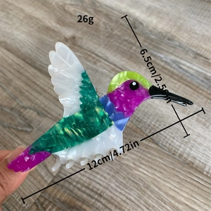 Pince à cheveux colibri en acétate coloré avec texture marbrée violette et verte