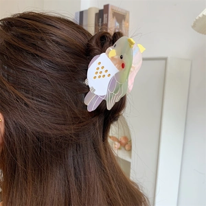 Cockatiel bird claw clip made of high-quality acetate hair accessory shown on hair