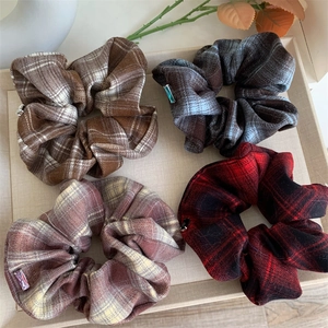 Classic plaid scrunchies set with crystal charms featuring vintage British check patterns