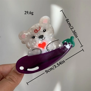 Whimsical acetate bear and eggplant hair claw clip showing size and weight specs