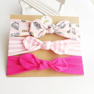 Three-pack cotton baby headbands with unicorn prints and bow knots on display card