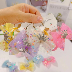 Detail of colorful mesh bow hair ties with sparkling rhinestone crowns for girls