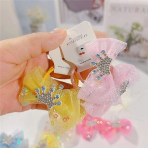 Detail of colorful mesh bow hair clips for girls with sparkling rhinestone crown accents
