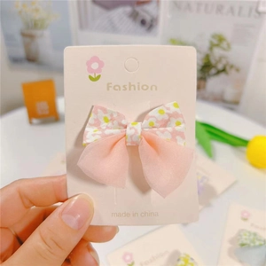 Pink floral bow hair clip for girls with elegant organza layer on white display card