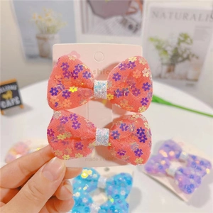 Coppia di fermagli per capelli in rete arancione per bambine con fiori di paillettes