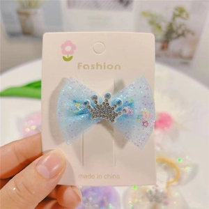 Blue glitter mesh bow hair clip for girls featuring a sparkly rhinestone silver crown accessory
