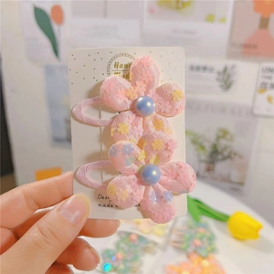 Paire de barrettes fleurs artisanales avec paillettes pour filles en rose et bleu