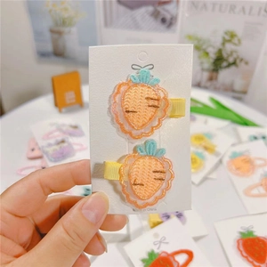 Cute knitted carrot hair clips for baby girls featuring soft fabric wrapped safety metal base