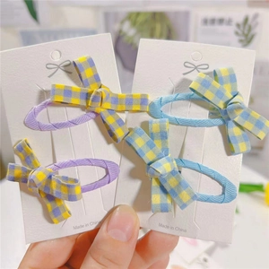 Detailed set of fabric plaid bow hair clips in light purple and blue on display cards