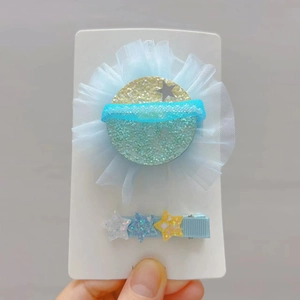 Ensemble de deux jolies barrettes planète avec motifs étoiles et volants en tulle