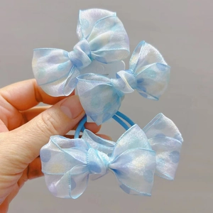 Detailed view of light blue polka dot organza bow hair ties with high elastic bands
