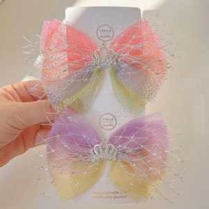 Detail of girls' gradient mesh bow hair clips with silver crown and handmade finish
