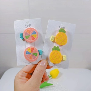 Cute fruit-shaped hair clips for girls including orange and pineapple resin designs