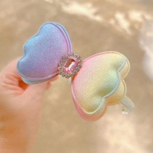 Glittery gradient butterfly bow headband with pink crystal and shell texture for girls