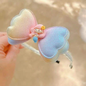 Kids gradient glitter heart bow headband featuring a cute little mermaid doll accessory