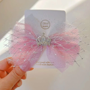 Detail of glitter mesh bow with silver rhinestone crown for girl hair accessories