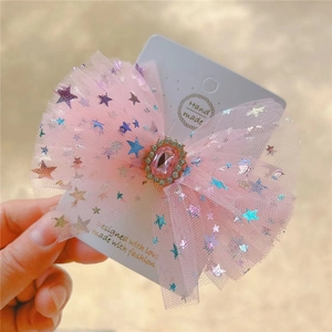 Pink mesh bow hair clip with laser stars and center rhinestone on display card