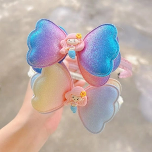 Détail de serre-têtes dégradés pailletés avec figurines sirène pour petites filles