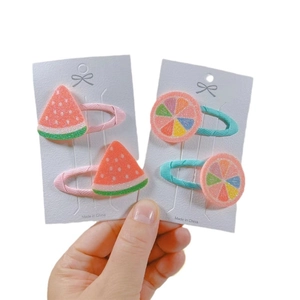 Cute fruit hair clips set with glittery watermelon and orange designs for girls