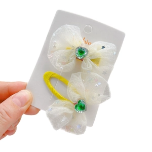 Barrettes enfants avec nœuds en résille crème, strass cœur vert et pinces jaunes en métal