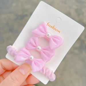 Elegant 3-piece set of pink silk bow hair clips for girls featuring white pearl accents