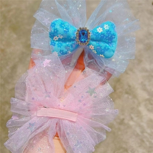 Detail of blue and pink sequin mesh hair clips with pear-cut crystal for girls