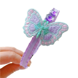 Ethnic style butterfly headband with purple embroidered wings and heart sequins
