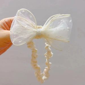 Elastisches Baby-Stirnband in Creme mit Netzschleife und Kunstperlen für Säuglinge
