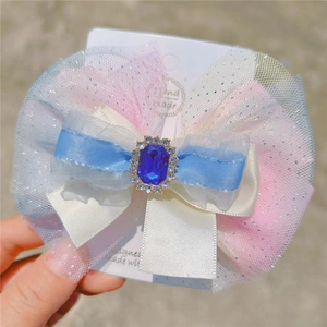 Barrette à nœud dégradé rose et bleu avec pierre bleue ornée pour petites filles