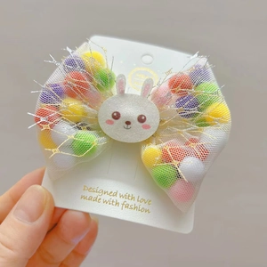 Cute mesh rabbit bow hair clip for kids featuring colorful pom-poms inside mesh wings