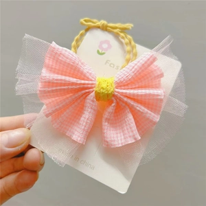 Chouchou noeud à carreaux roses pour fillettes avec mesh blanc et fleur jaune