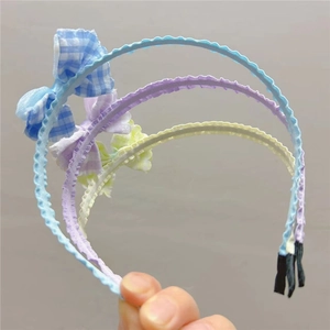 Set di tre cerchietti per capelli per bambine con fiocchi a quadretti colorati