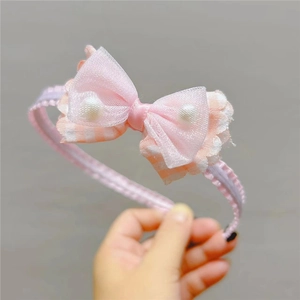 Cerchietto rosa per bambine con fiocco in tulle e perle per feste e uso quotidiano