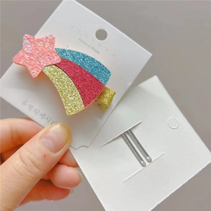 Glittery pink star and rainbow sequin hair clip for girls with a silver metal alligator base