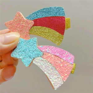 Detail of glitter meteor hair clips for girls with colorful sequin rainbow tails