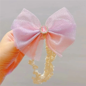 Baby elastic lace headband featuring a large gradient pink and purple mesh bow with gems