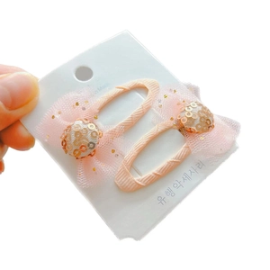 Paire de barrettes à cheveux en mesh rose avec paillettes dorées pour coiffure de fille